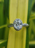 Lab Grown Oval Cut Halo Engagement Ring With Twisted Band