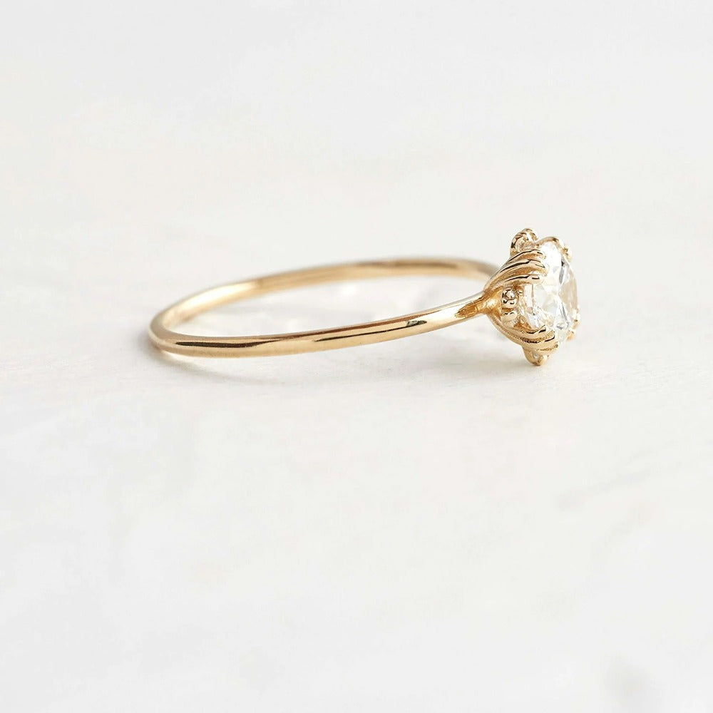 Colorless Moissanite Round Cut Hidden Accent Engagement Ring