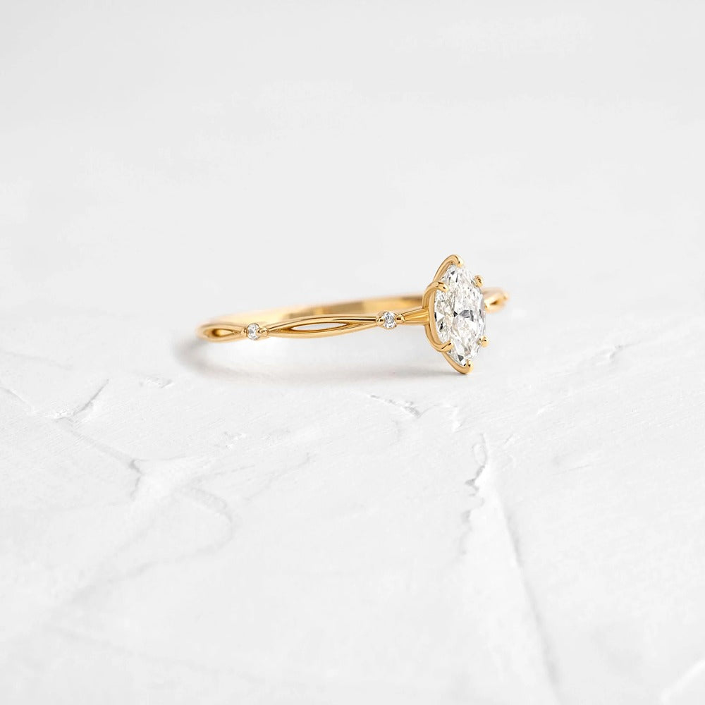 Twisted Marquise Cut Colorless Moissanite Proposal Ring