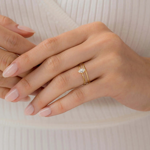 Twisted Marquise Cut Colorless Moissanite Proposal Ring