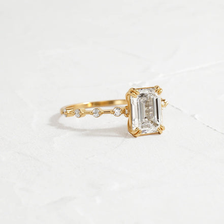 Hidden Accent Moissanite Emerald Cut Engagement Ring