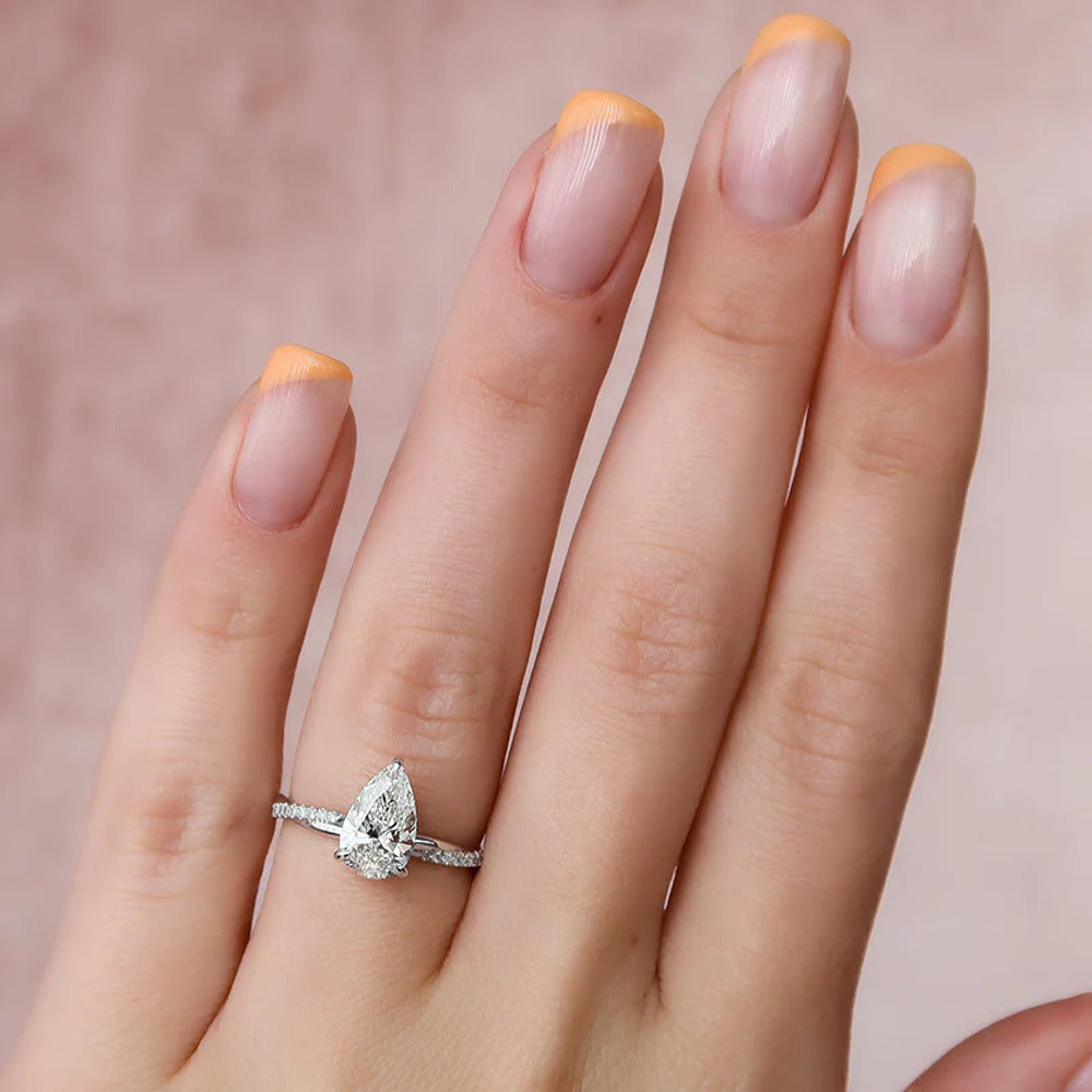 Twisted Style Pear Cut Moissnaite Engagement Ring