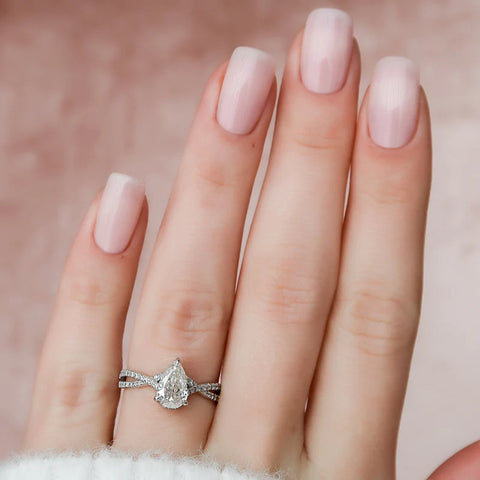 Pear Cut Hidden Accent Twisted Band Moissnaite Ring