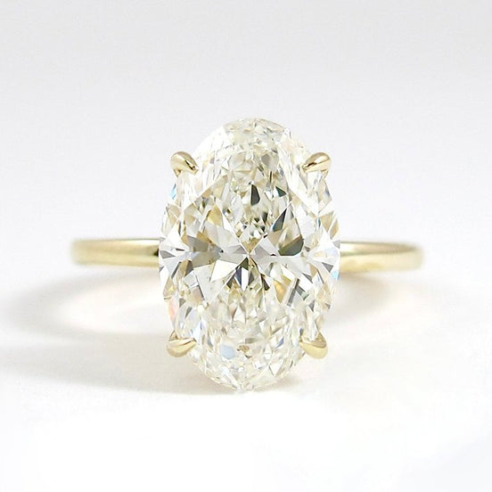 Hidden Accent Colorless Moissanite Oval Cut Ring