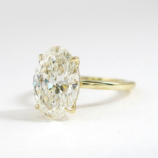 Hidden Accent Colorless Moissanite Oval Cut Ring