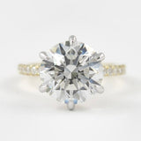 Two Tone D Color Moissnaite Round Cut Side Accent Engagement Ring