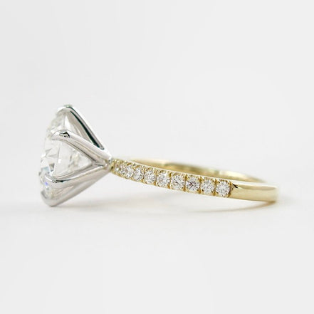 Two Tone D Color Moissnaite Round Cut Side Accent Engagement Ring
