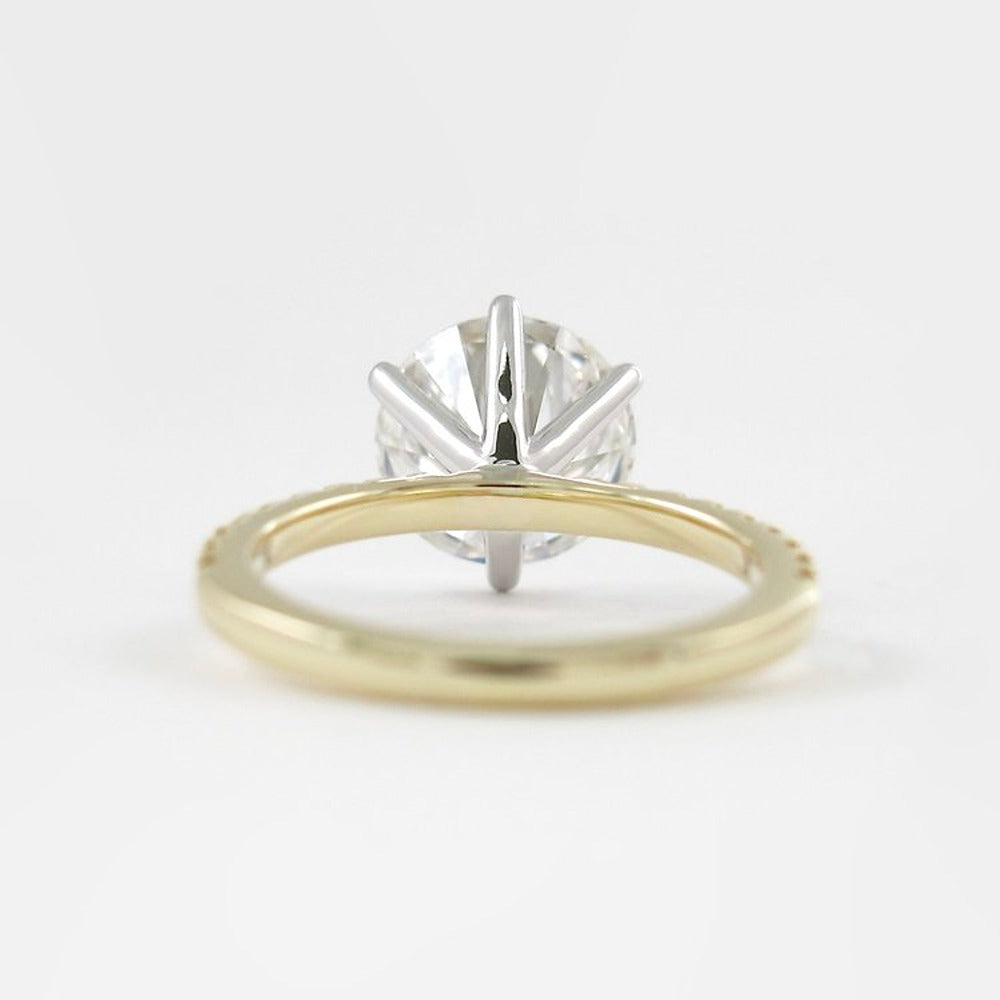 Two Tone D Color Moissnaite Round Cut Side Accent Engagement Ring