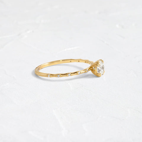 Side Accent Round Cut Moissanite Promise Ring