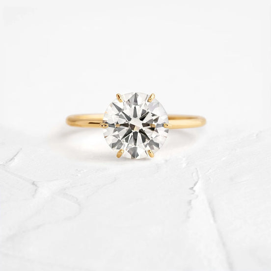 Round Cut Hidden Accent Moissanite Engagement Ring
